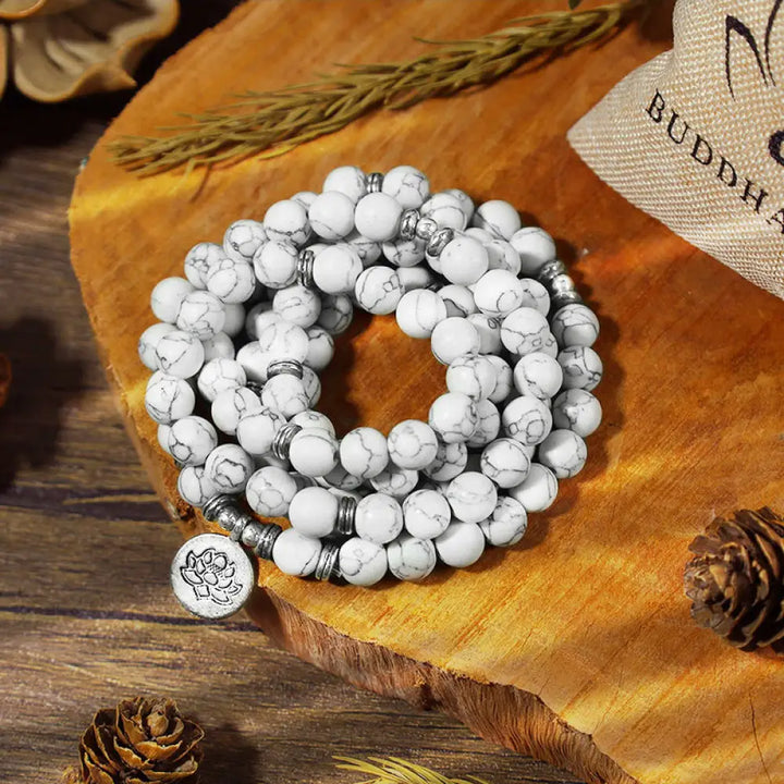 BWOOOH White Turquoise Lotus Mala Healing Bracelet: 108 polished 8mm White Turquoise beads, central lotus charm. Designed for meditation, spiritual balance, and attracting calm, positive energy.