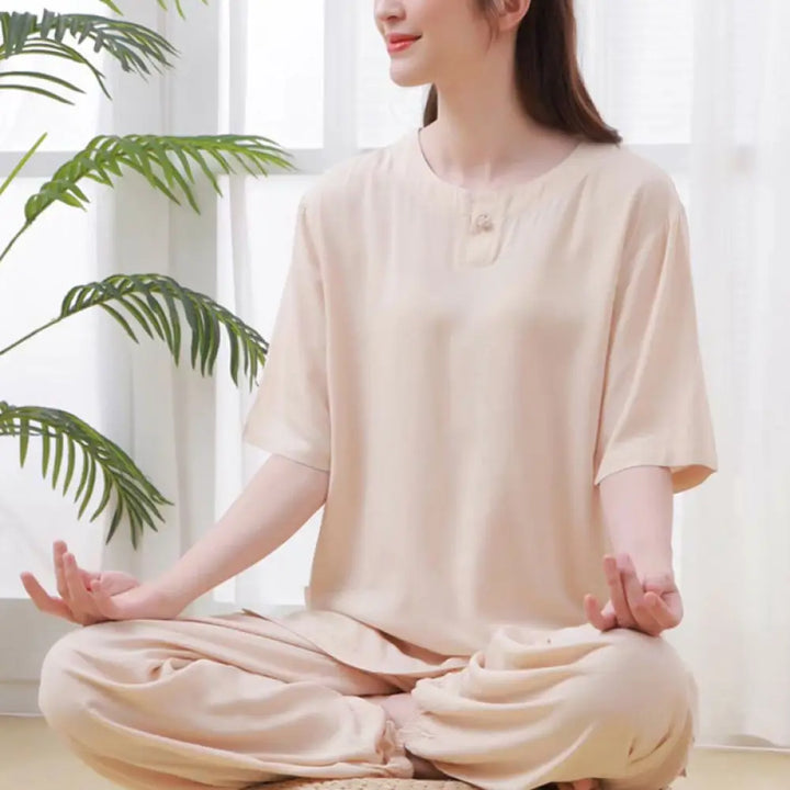 Women wearing a minimalist 2-piece cotton meditation set with frog-button details.