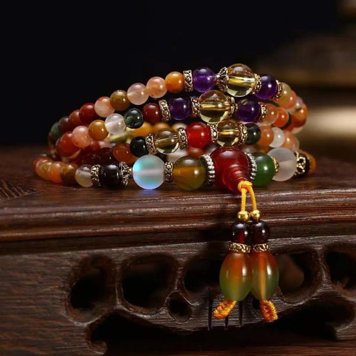 BWOOOH The 108 Quartz Healing Mala Bracelet, featuring iridescent Clear Quartz, vibrant Amethyst, deep Garnet, and calming Red Agate beads on an elastic strand, designed for focused meditation and spiritual balance. Ideal for yoga and daily mindfulness practices.