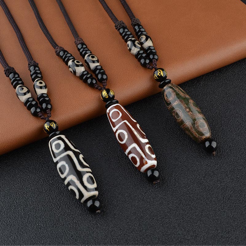 BWOOOH Nine-Eye Dzi Bead Wealth Protection Necklace — hand-painted Tibetan dzi bead 14×40mm with Black Onyx for wealth, protection & all-wish fulfillment