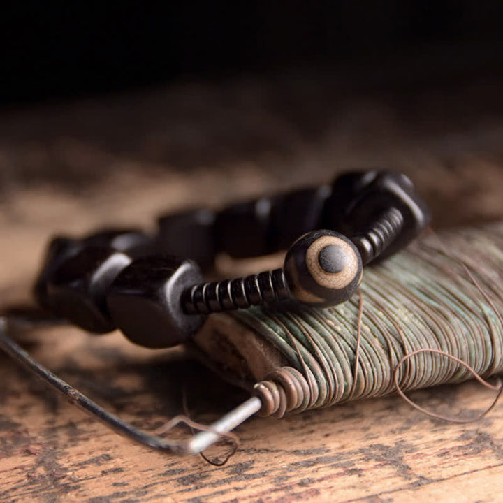 BWOOOH Tibetan Ebony Wood Dzi Bead Strength Bracelet  -  Ebony Tibetan bracelet for spiritual healing and mindful living