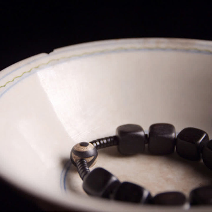 BWOOOH Tibetan Ebony Wood Dzi Bead Strength Bracelet  -  Ebony Tibetan bracelet for spiritual healing and mindful living