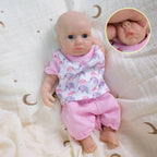 Luna 8-inch solid silicone baby doll, water-safe, with movable limbs and soft, lifelike features.