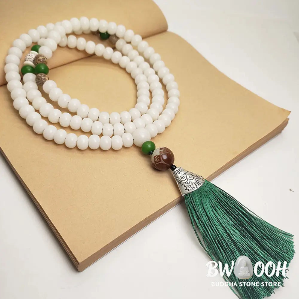 BWOOOH White Bodhi Seed Mala 108 beads bracelet, natural, unisex, displaying unique speckles and a smooth finish, ideal for meditation and spiritual protection. - View 3