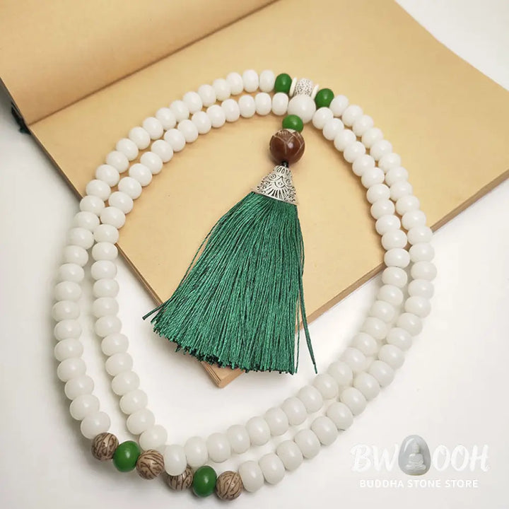 BWOOOH White Bodhi Seed Mala 108 beads bracelet, natural, unisex, displaying unique speckles and a smooth finish, ideal for meditation and spiritual protection. - View 2
