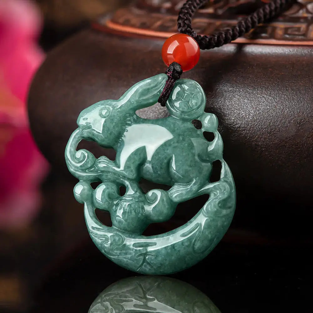 BWOOOH handcrafted Year of the Rabbit Jade Luck Crescent Moon Necklace Pendant: a polished natural jade (31x26x5.5mm) with subtle rabbit carving, on a 50cm chain. Unisex design for prosperity, protection, and spiritual balance.